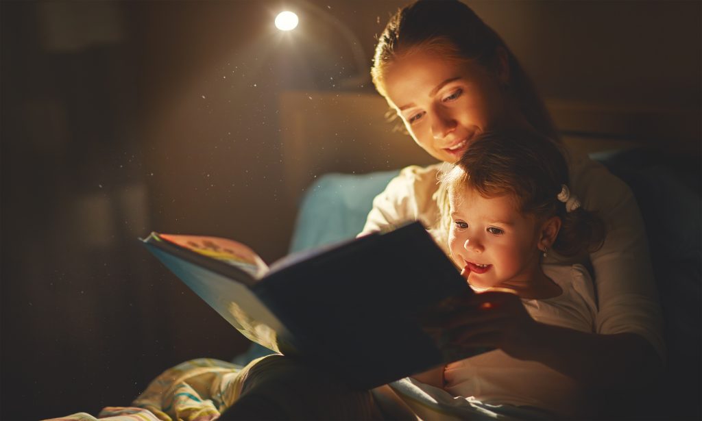 Mum reading a bedtime story with her daughter